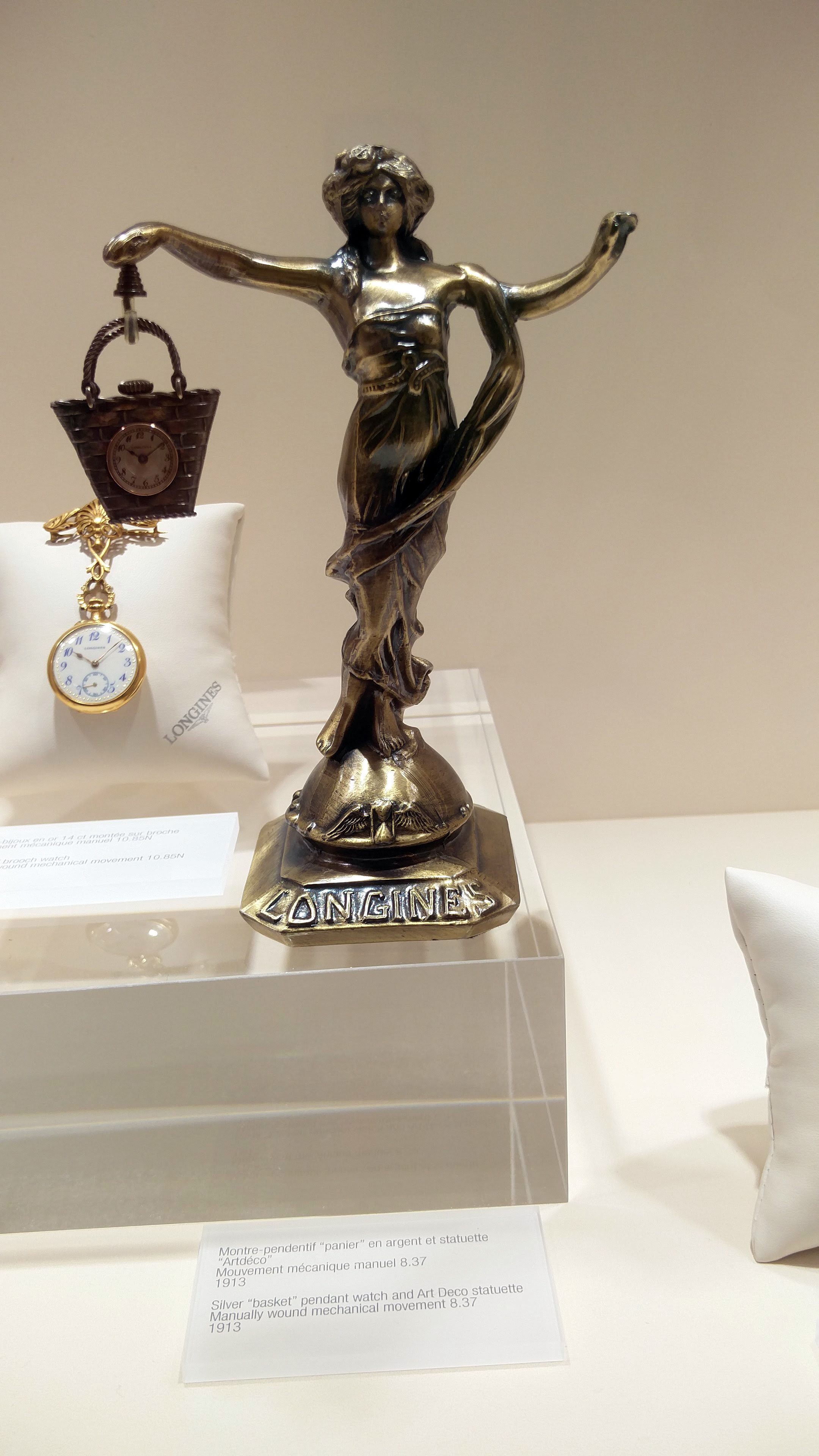 Silver “basket” pendant watch, and Art Deco statuette 