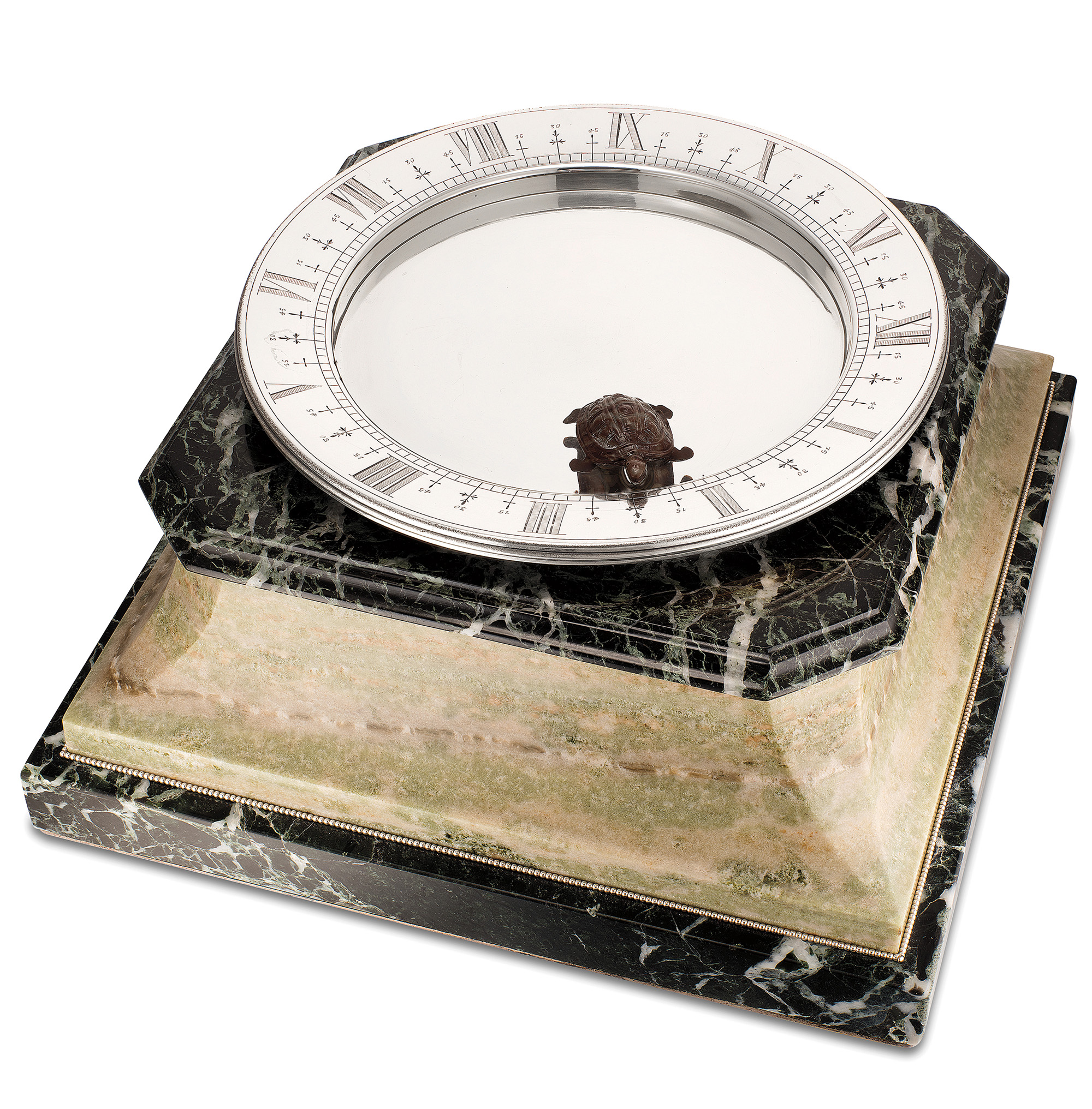 Extremely rare and unusual, silver and marble magnetic floating table clock by Cartier. Sold for $487,540