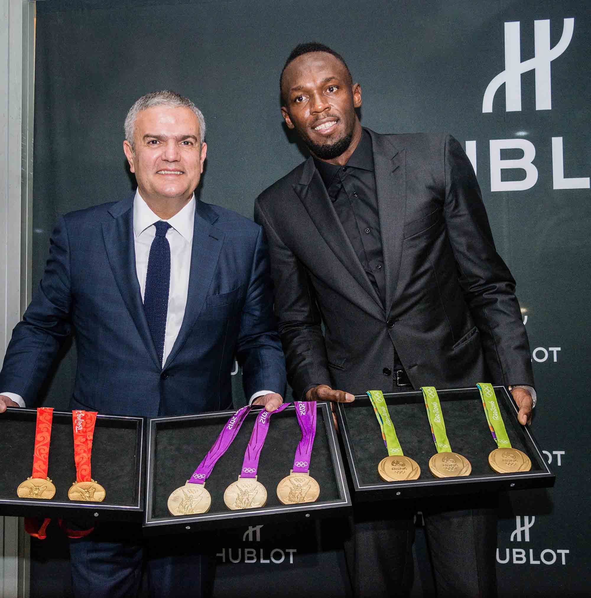 Usain Bolt in Mexico City with his gold medals