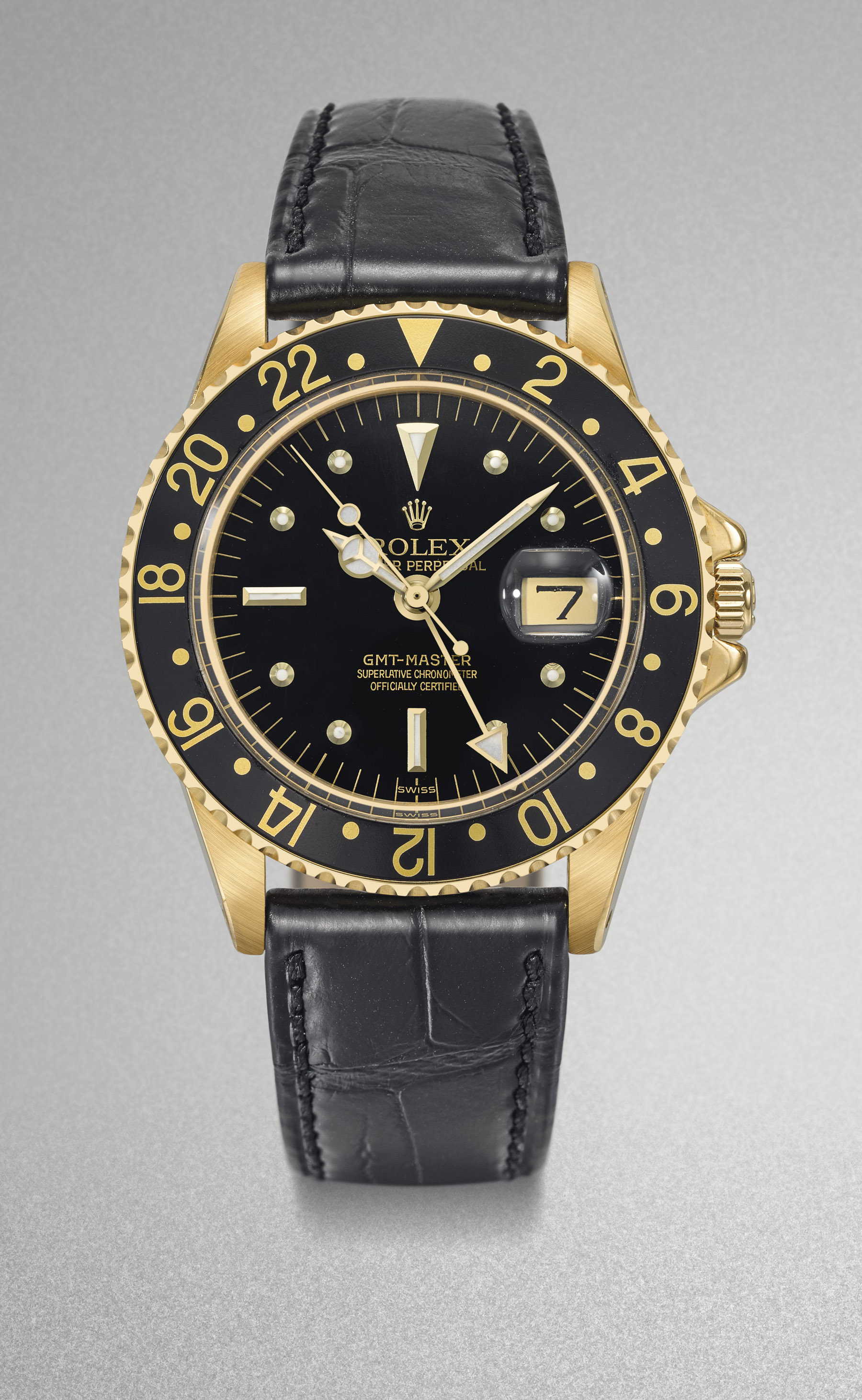 Rolex. A fine 18K gold automatic two time-zone time wristwatch with sweep centre seconds, black nipple dial, 24 hour bezel and date Ref. 1675/8, circa 1970 Estimate CHF 12,000 – 16,000