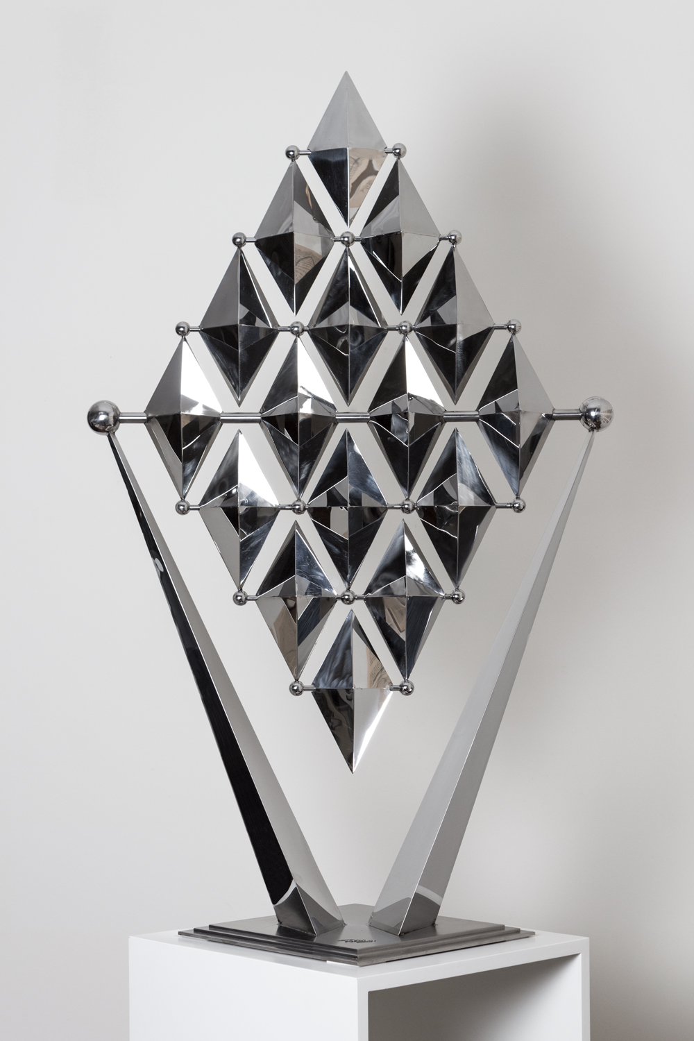 Ralfonso masters kinetic sculpture with unparalleled imagination and an exceptional ability to set art into motion. These unique talents shine through in KARO, a German word for rhombus, a geometric diamond shape. Closer inspection of this 120 cm tall artwork, limited to just 10 pieces, reveals 16 self-balancing diamond-shaped elements forming an even larger rhombus. The striking, clean lines come to life with the slightest breeze or touch of the hand, moving each rhombus back and forth in an unlimited combination of patterns.