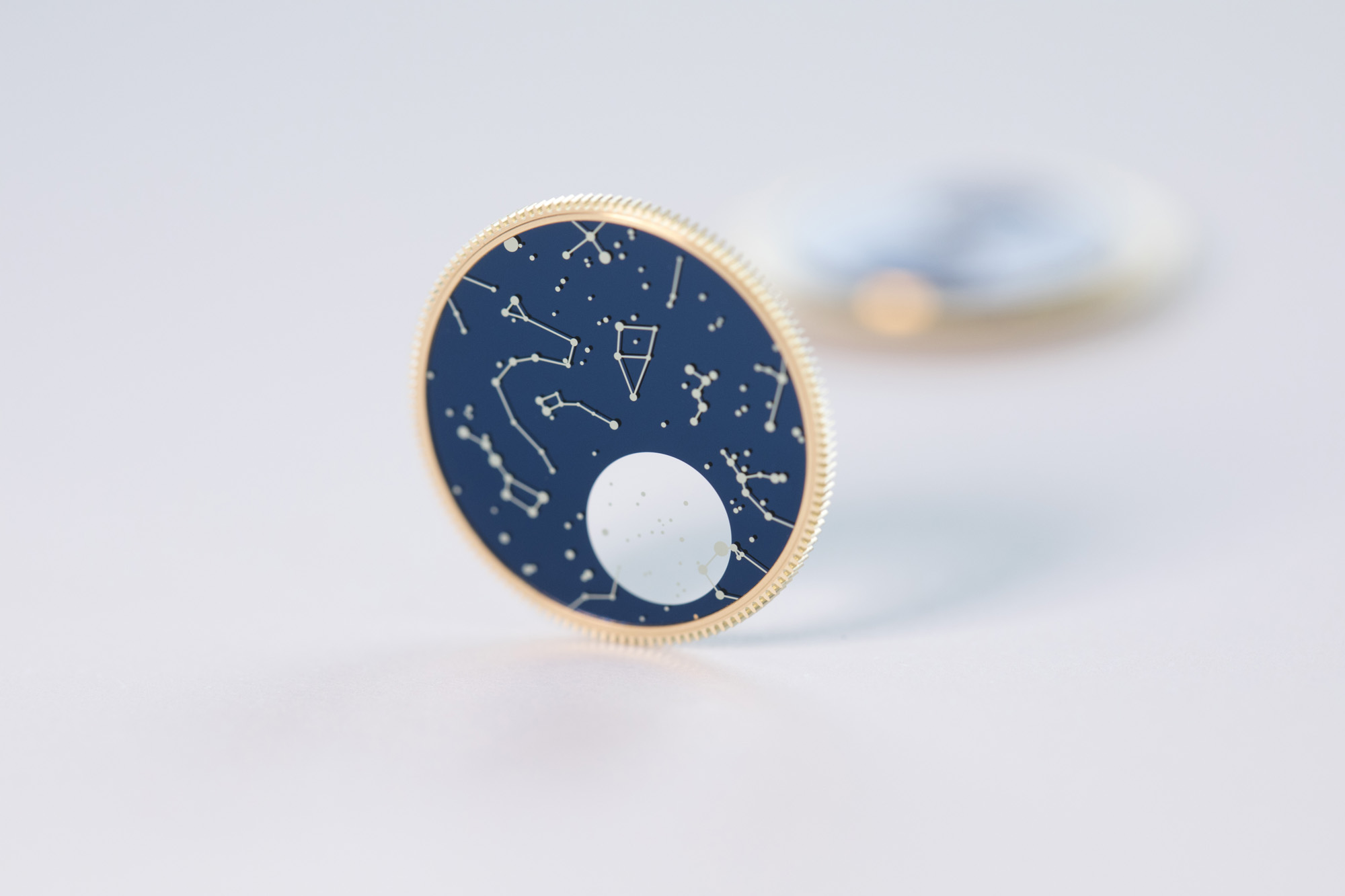 The moon phase display is painted and lacquered to create a shiny appearance