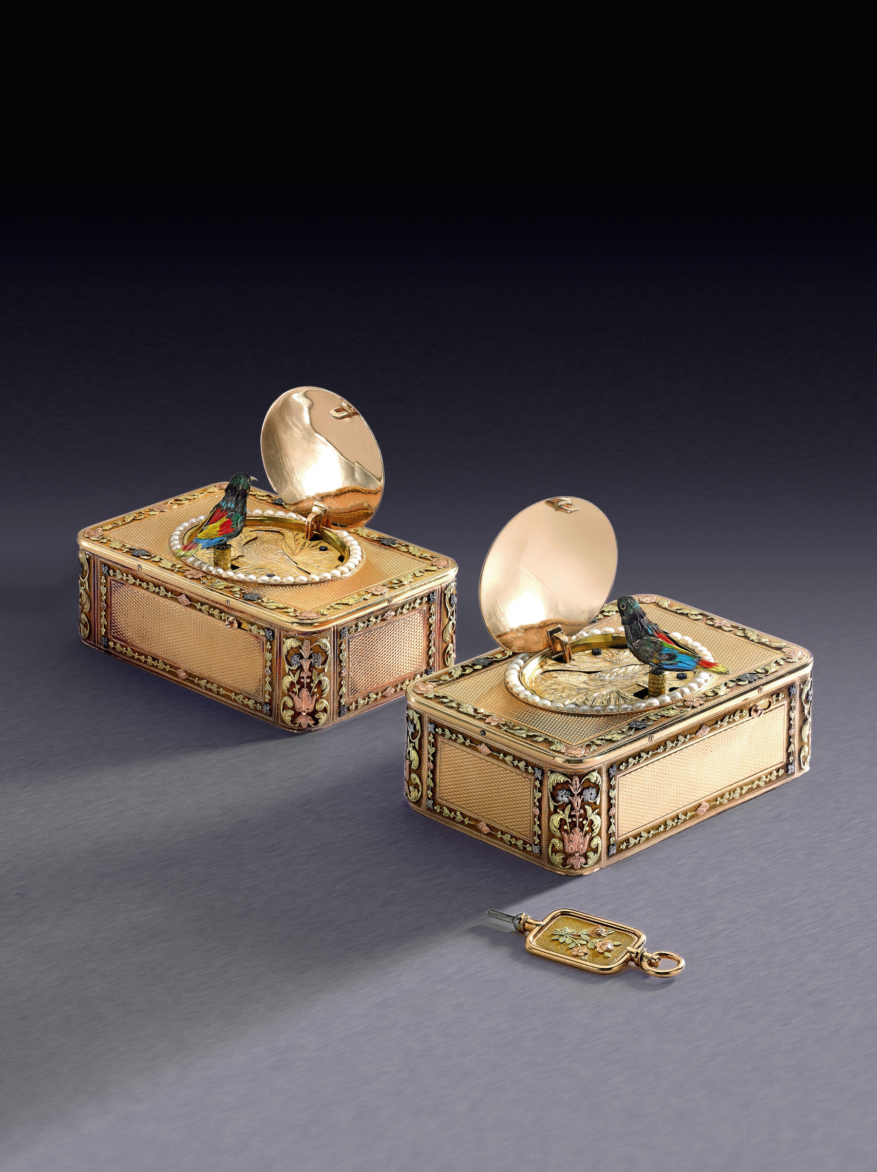 An Impressive And Rare Consecutively Numbered Pair Of Four-Color Gold And Pearl Singing Bird Snuff Boxes For The Chinese Market Circa 1820