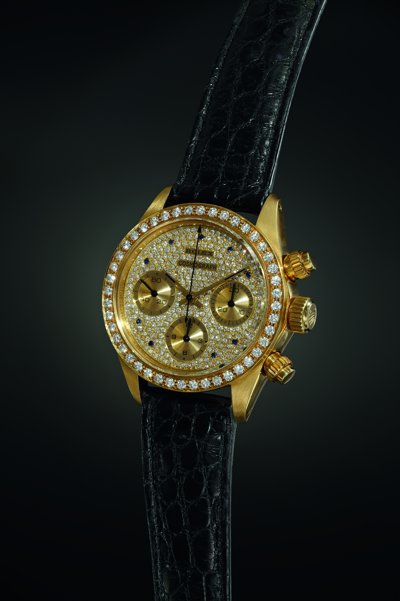 An exceedingly exclusive and lavish diamond and sapphire-set yellow gold chronograph wristwatch, made for the French market. Realised CHF 606,500