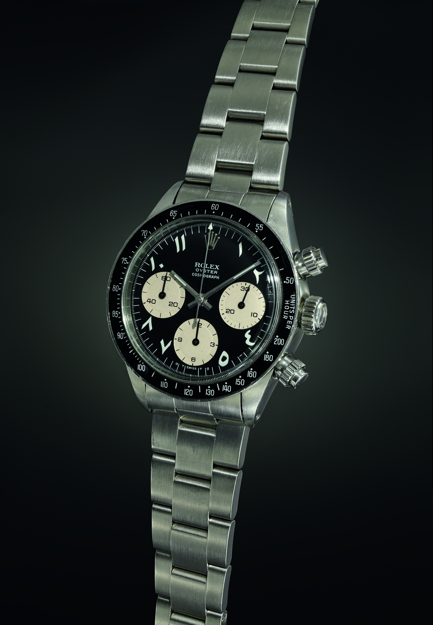 An exquisite, important and most probably unique chronograph wristwatch with black dial displaying white Arabic-Indic numerals, and bracelet. Realised CHF 1,932,500