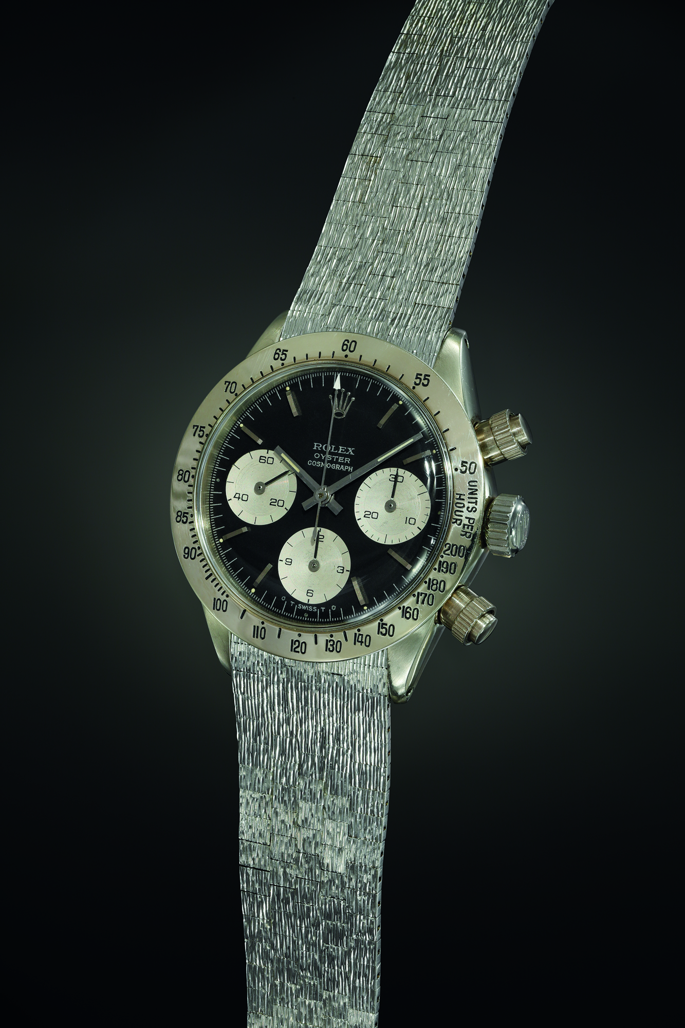Achieved the second highest price for a Rolex wristwatch at an auction. It's a historically important and exceedingly attractive white gold chronograph wristwatch with black dial and bark finished bracelet, the only one known of its kind. Amount realised CHF 5,937,500.