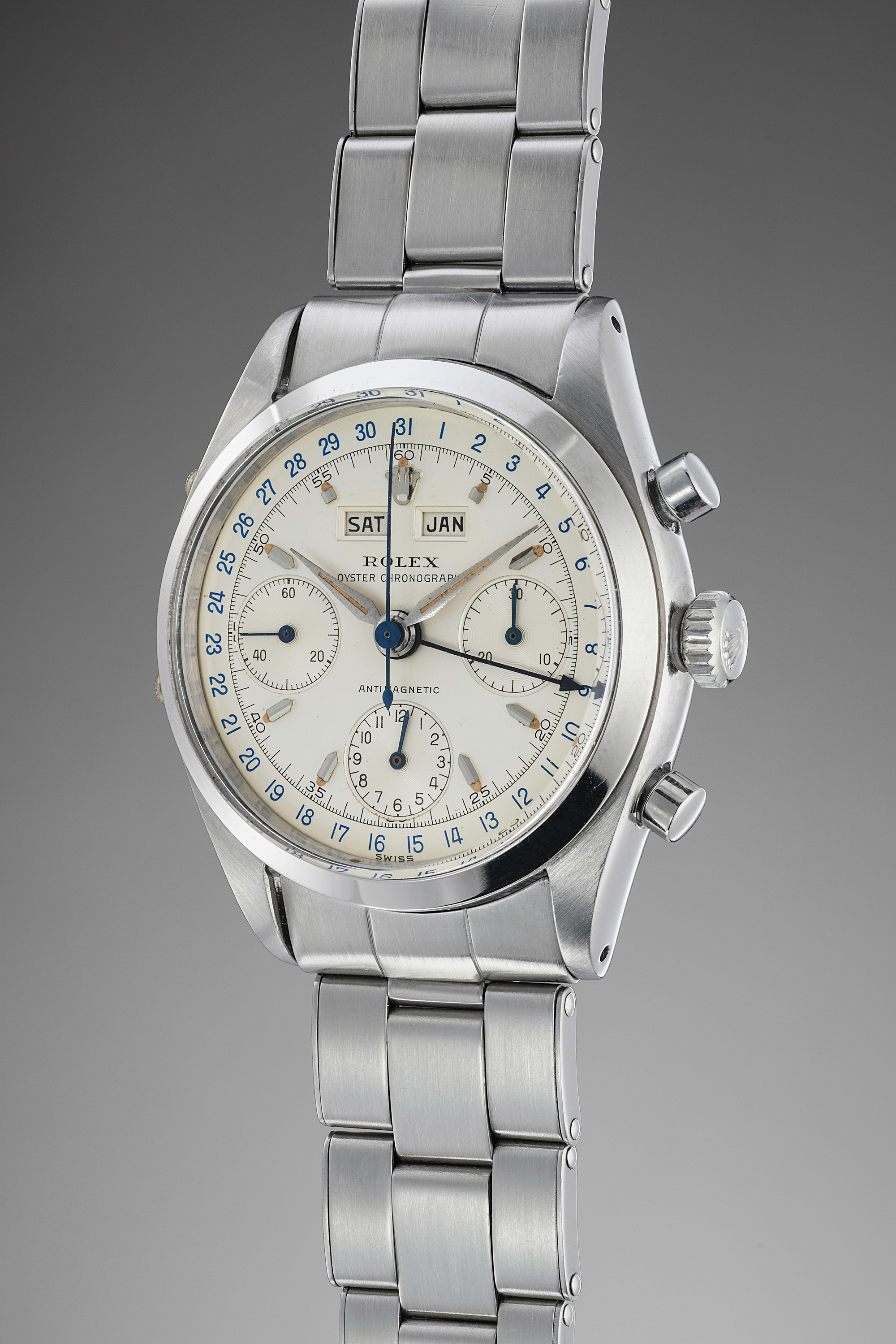 A very fine and rare, incredibly well preserved stainless-steel triple calendar chronograph wristwatch with bracelet. World record for any Rolex “Jean-Claud Killy” ever sold at auction.