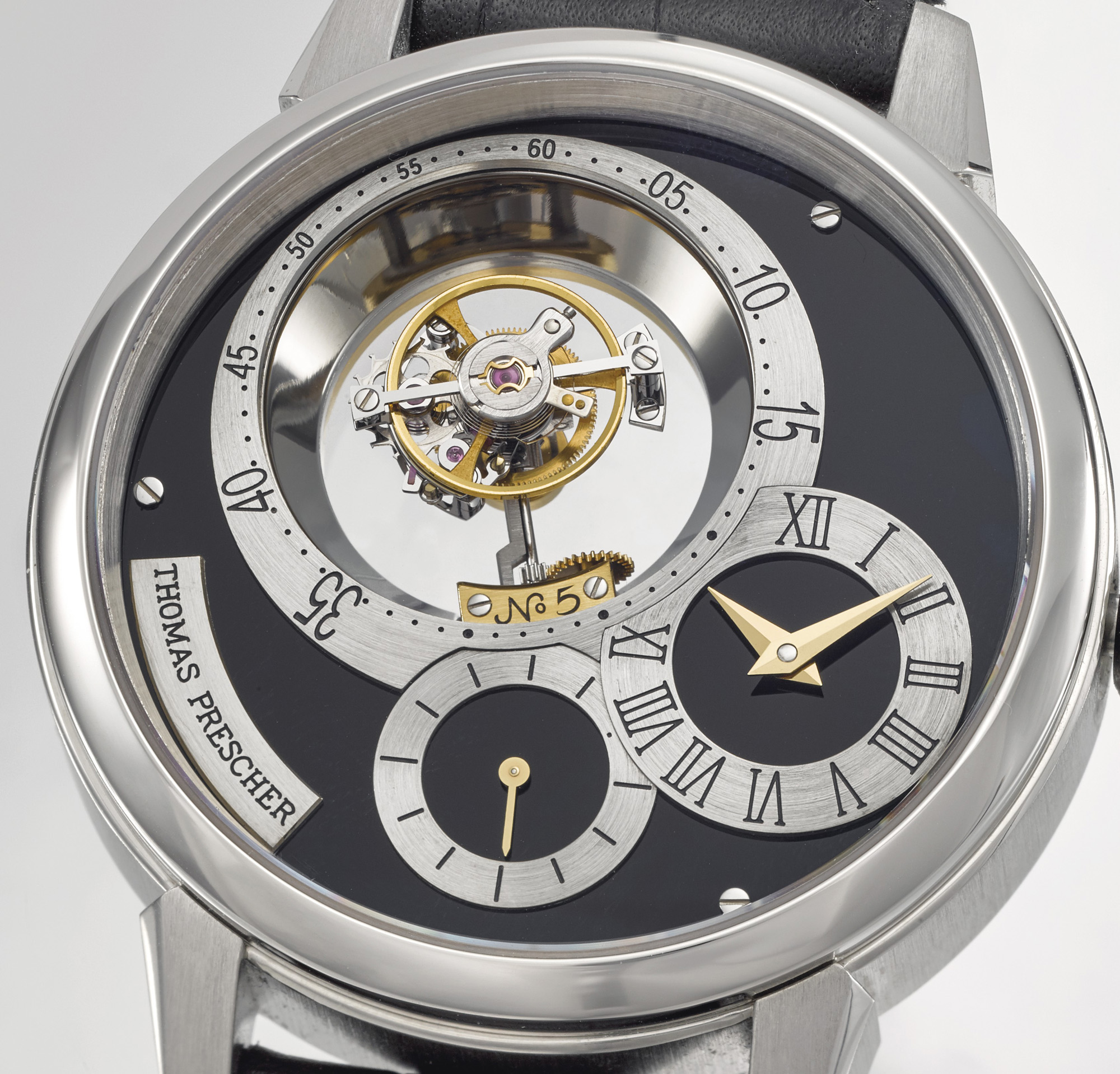 Thomas Prescher Tourbillon This is the first Thomas Prescher Tourbillon to be offered at public auction. Consigned by the original owner, the watch features a triple axis flying tourbillon with a constant force mechanism. It is also the first wristwatch to feature a constant force mechanism within the tourbillon carriage itself.